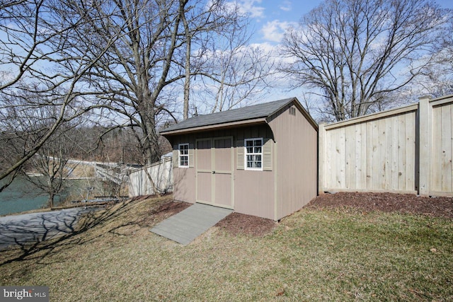 view of outbuilding featuring a yard