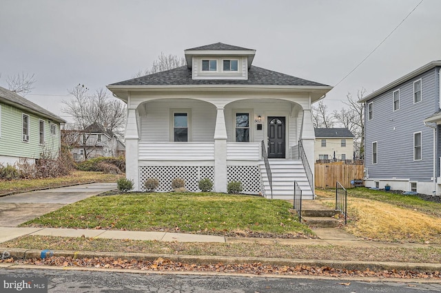 bungalow-style house with a porch and a front yard