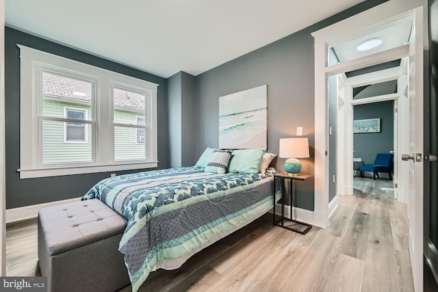 bedroom with light hardwood / wood-style floors