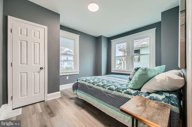 bedroom featuring light wood-type flooring