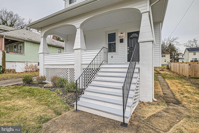 doorway to property featuring a porch