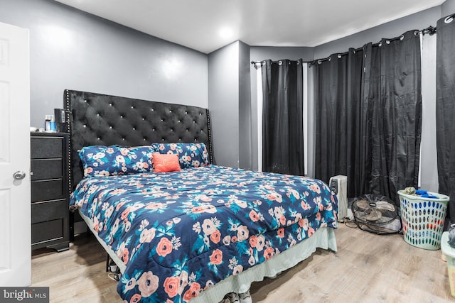 bedroom with wood-type flooring