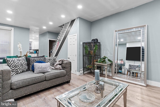 living room with light hardwood / wood-style flooring