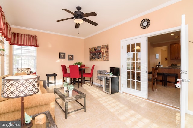 living room featuring ceiling fan, ornamental molding, light tile patterned floors, and french doors