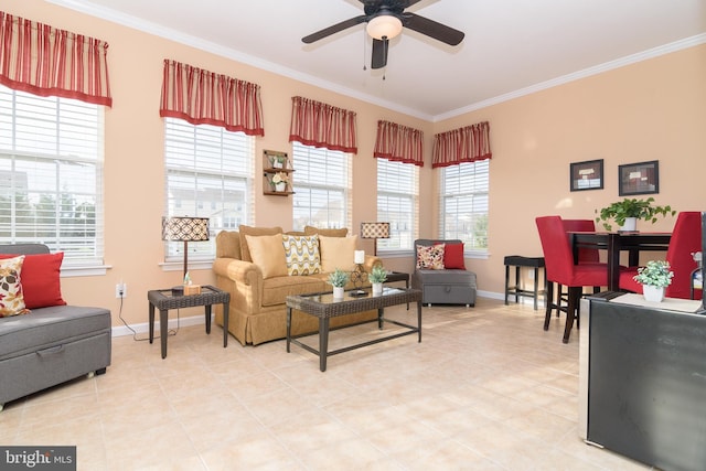 living room featuring tile patterned flooring, crown molding, ceiling fan, and a healthy amount of sunlight