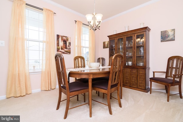 carpeted dining area featuring ornamental molding and a chandelier