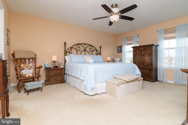 bedroom featuring ceiling fan and light colored carpet