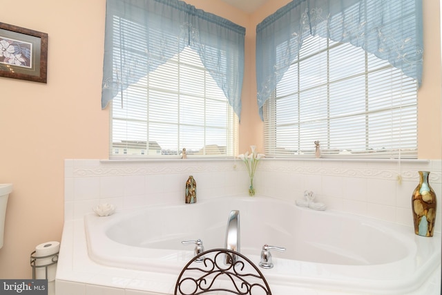 bathroom featuring a relaxing tiled tub