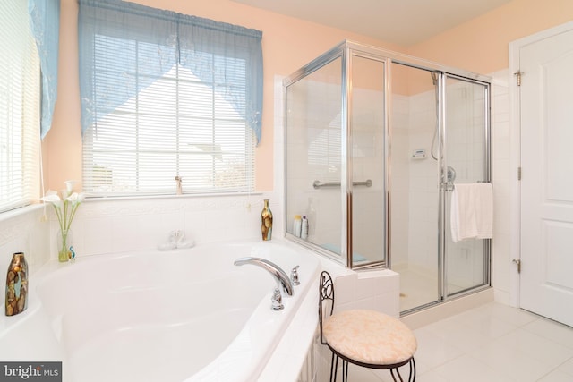 bathroom with tile patterned flooring and plus walk in shower