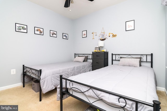 bedroom with ceiling fan and light colored carpet