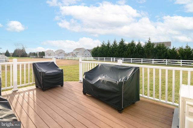 wooden deck featuring a lawn and area for grilling