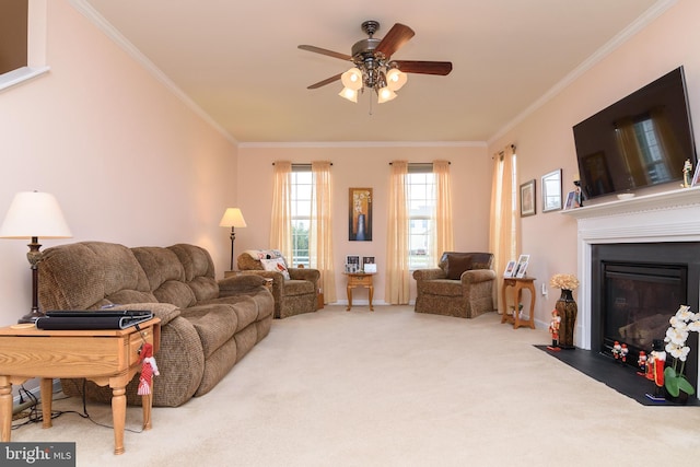 living room featuring crown molding, carpet, and ceiling fan