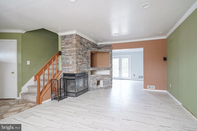 living room with a fireplace, french doors, light hardwood / wood-style flooring, and ornamental molding