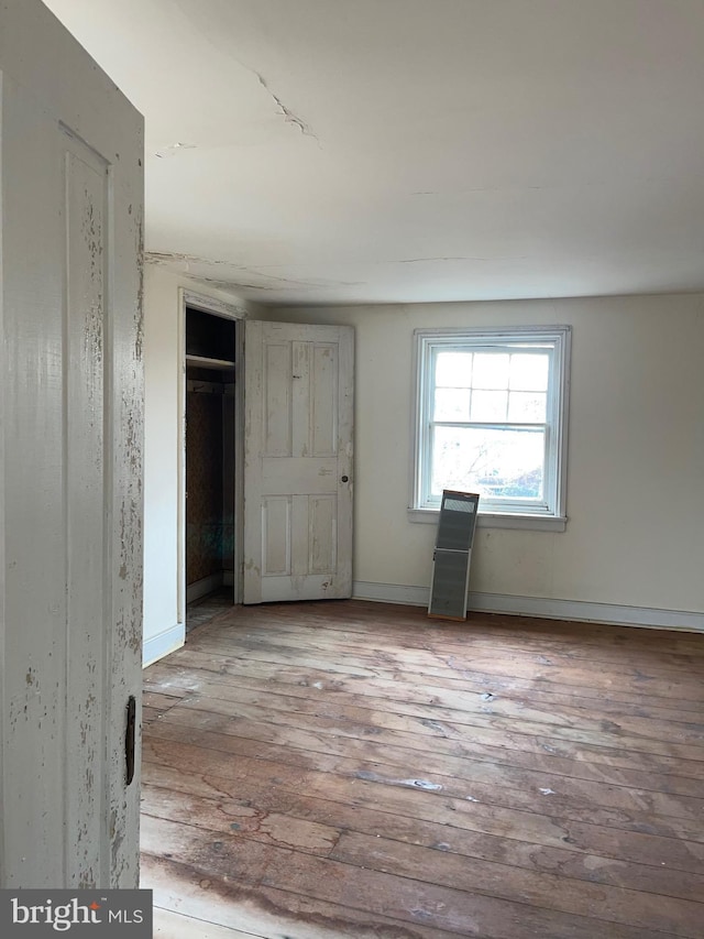 unfurnished room with light hardwood / wood-style flooring