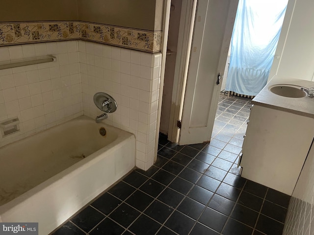 bathroom with tile patterned flooring, vanity, and shower / washtub combination