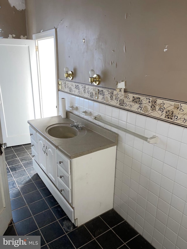 bathroom featuring tile patterned floors, vanity, and tile walls