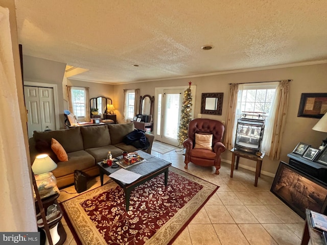 tiled living room with a textured ceiling and ornamental molding