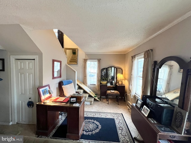 office with a wealth of natural light, crown molding, light tile patterned flooring, and a textured ceiling