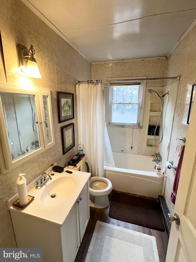 full bathroom with shower / bath combo, wood-type flooring, tile walls, and ornamental molding