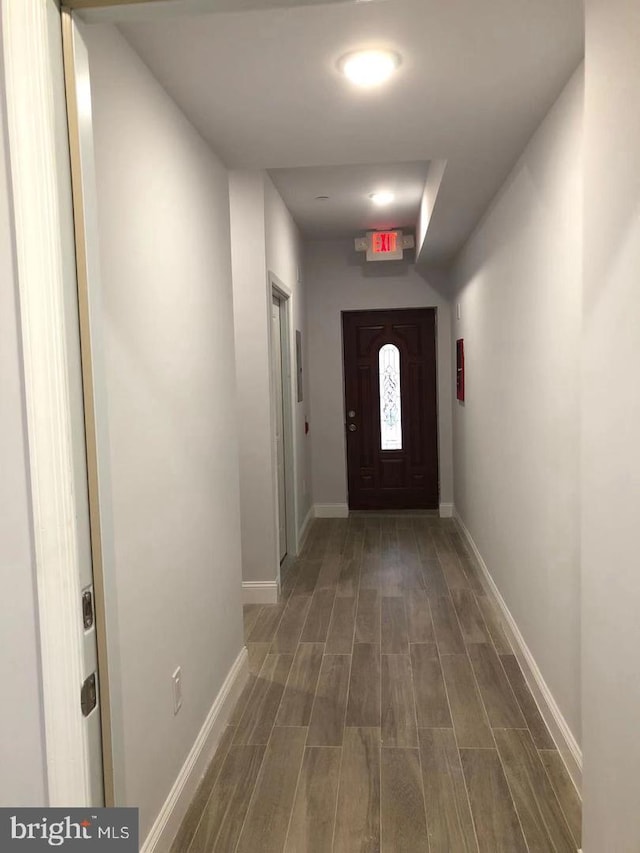 hall with dark hardwood / wood-style floors