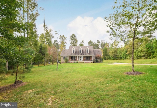 new england style home with a front yard