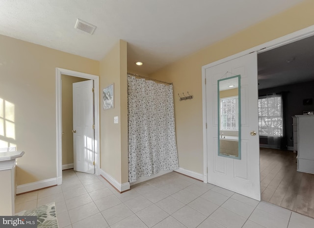 bathroom with wood-type flooring