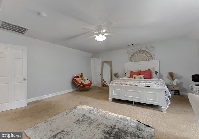 carpeted bedroom with ceiling fan and lofted ceiling