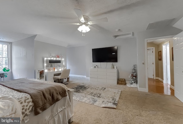 carpeted bedroom with a textured ceiling and ceiling fan