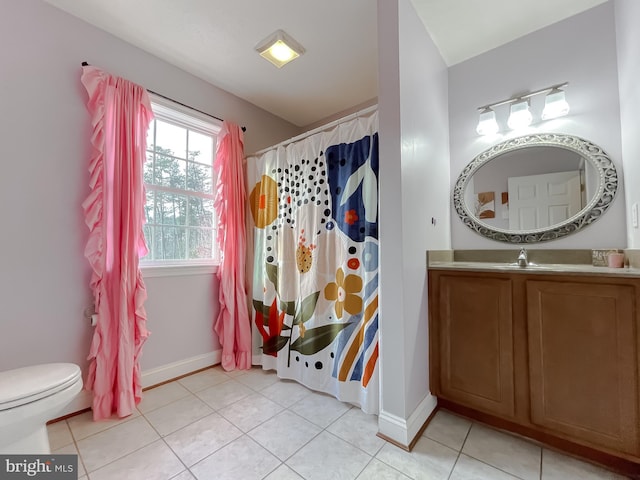 bathroom with tile patterned floors, vanity, a shower with shower curtain, and toilet