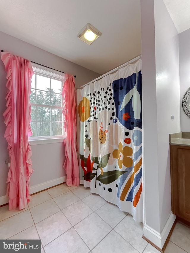 bathroom featuring tile patterned floors and vanity