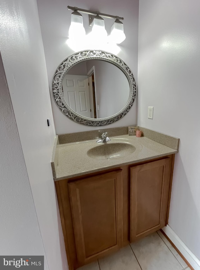 bathroom featuring tile patterned flooring and vanity