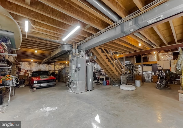 basement featuring heating unit and water heater