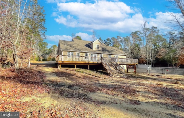 back of property with a wooden deck