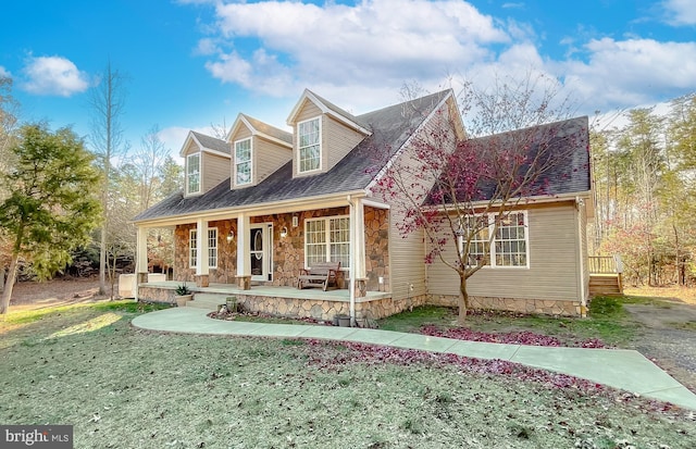 new england style home featuring a porch