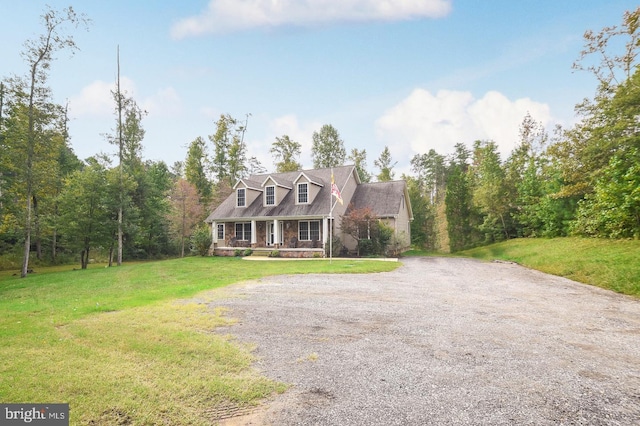 new england style home featuring a front yard