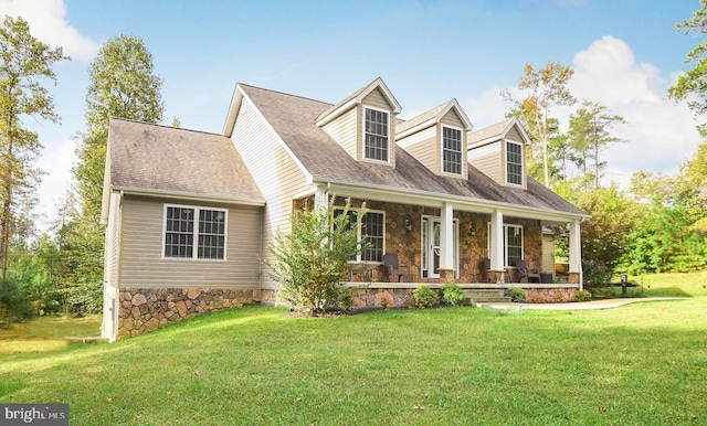 cape cod house with a porch and a front lawn