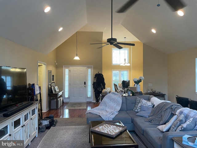 living room featuring dark hardwood / wood-style floors and high vaulted ceiling