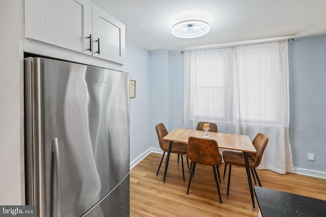 dining area with light hardwood / wood-style floors