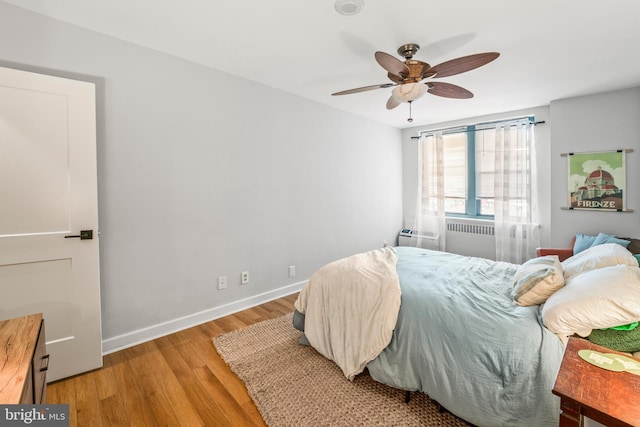 bedroom featuring ceiling fan and light hardwood / wood-style floors