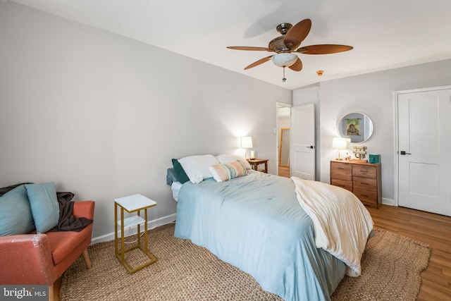 bedroom featuring ceiling fan and light wood-type flooring