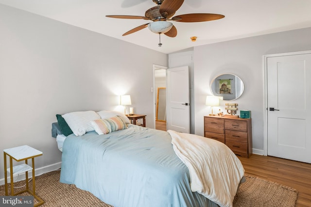 bedroom featuring hardwood / wood-style floors and ceiling fan