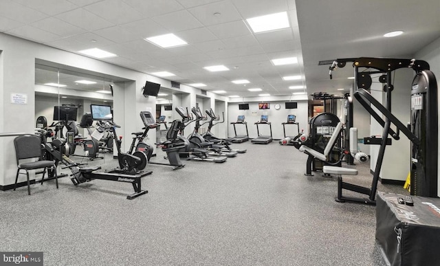 workout area featuring a paneled ceiling