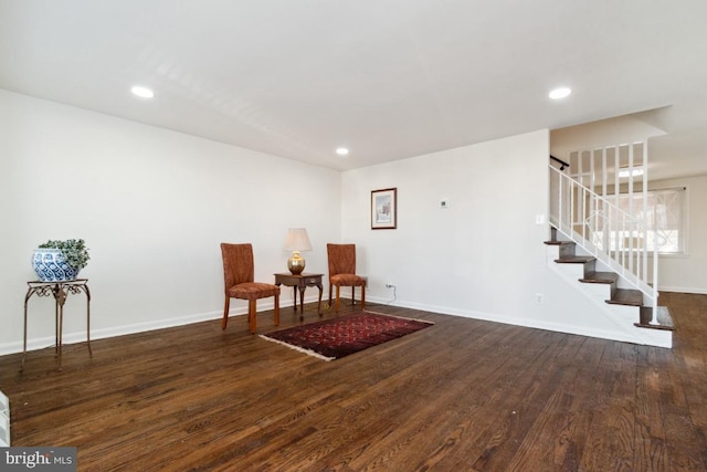 living area with dark hardwood / wood-style flooring