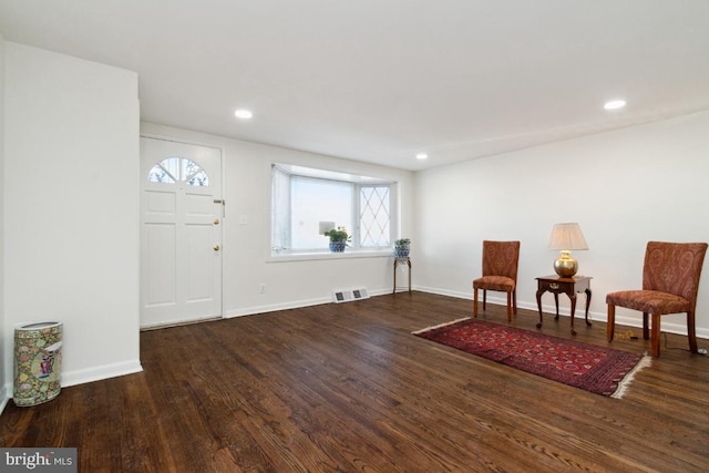 entryway with dark wood-type flooring