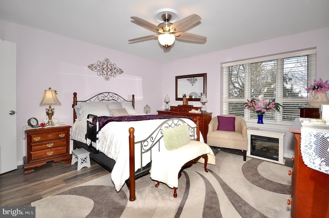 bedroom featuring hardwood / wood-style floors and ceiling fan