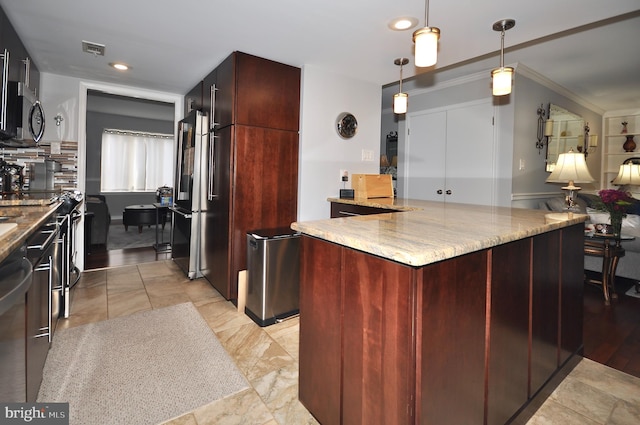 kitchen featuring light wood-type flooring, light stone counters, stainless steel appliances, crown molding, and decorative light fixtures