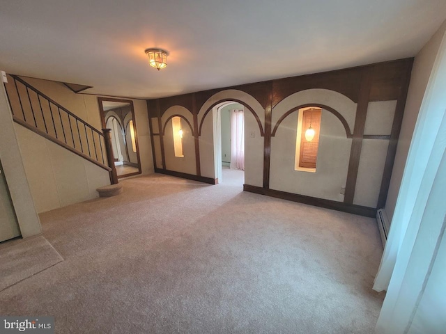 entryway with light colored carpet and baseboard heating