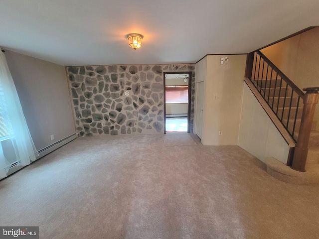 unfurnished living room with baseboard heating and light carpet