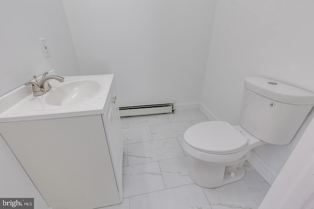 bathroom featuring vanity, a baseboard radiator, and toilet