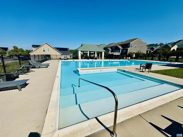 view of swimming pool with a patio area